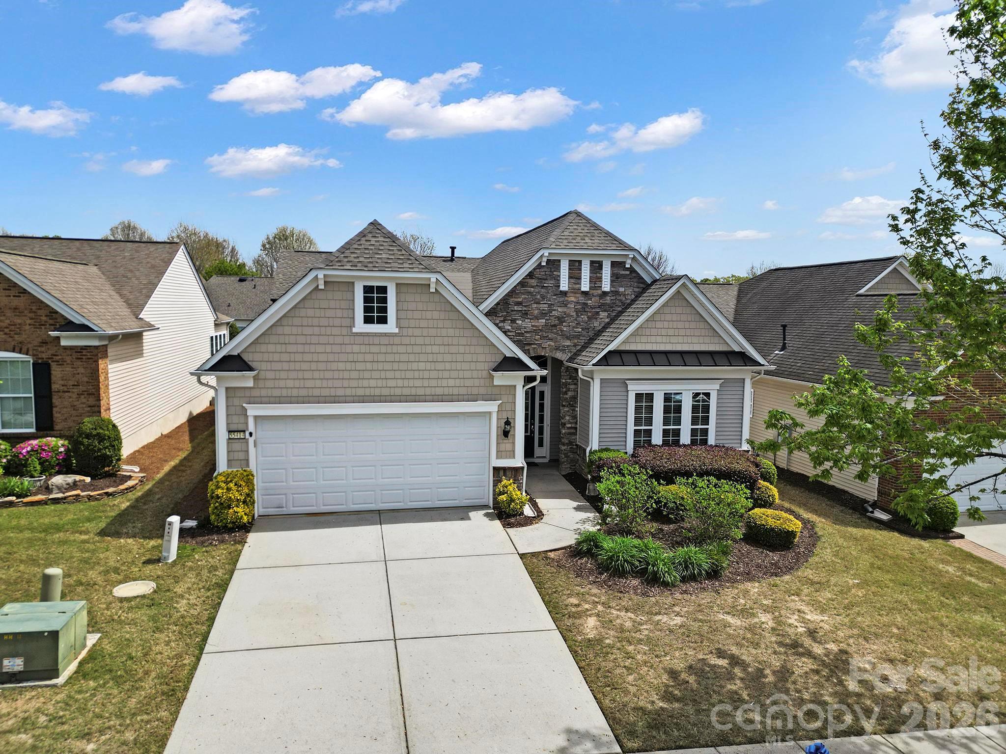 55414 Derringer Avenue Fort Mill, SC 29707 - Photo 38 of 45 a front view of a house with a yard