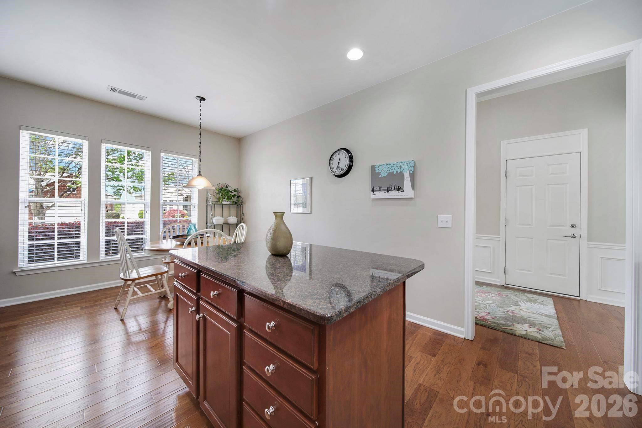 55414 Derringer Avenue Fort Mill, SC 29707 - Photo 6 of 45 a kitchen with a sink cabinets and wooden floor