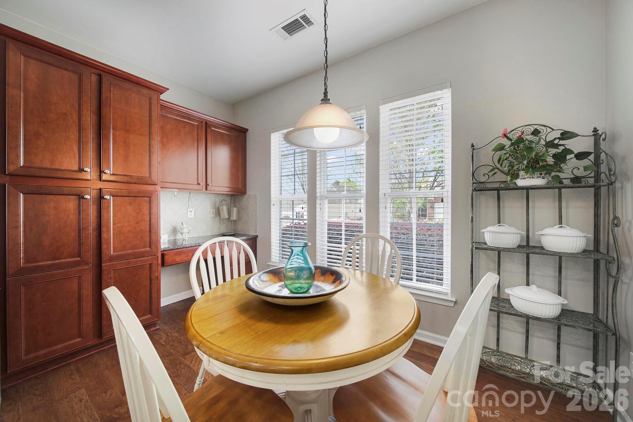 55414 Derringer Avenue Fort Mill, SC 29707 - Photo 7 of 45 a dining room with furniture a chandelier and wooden floor