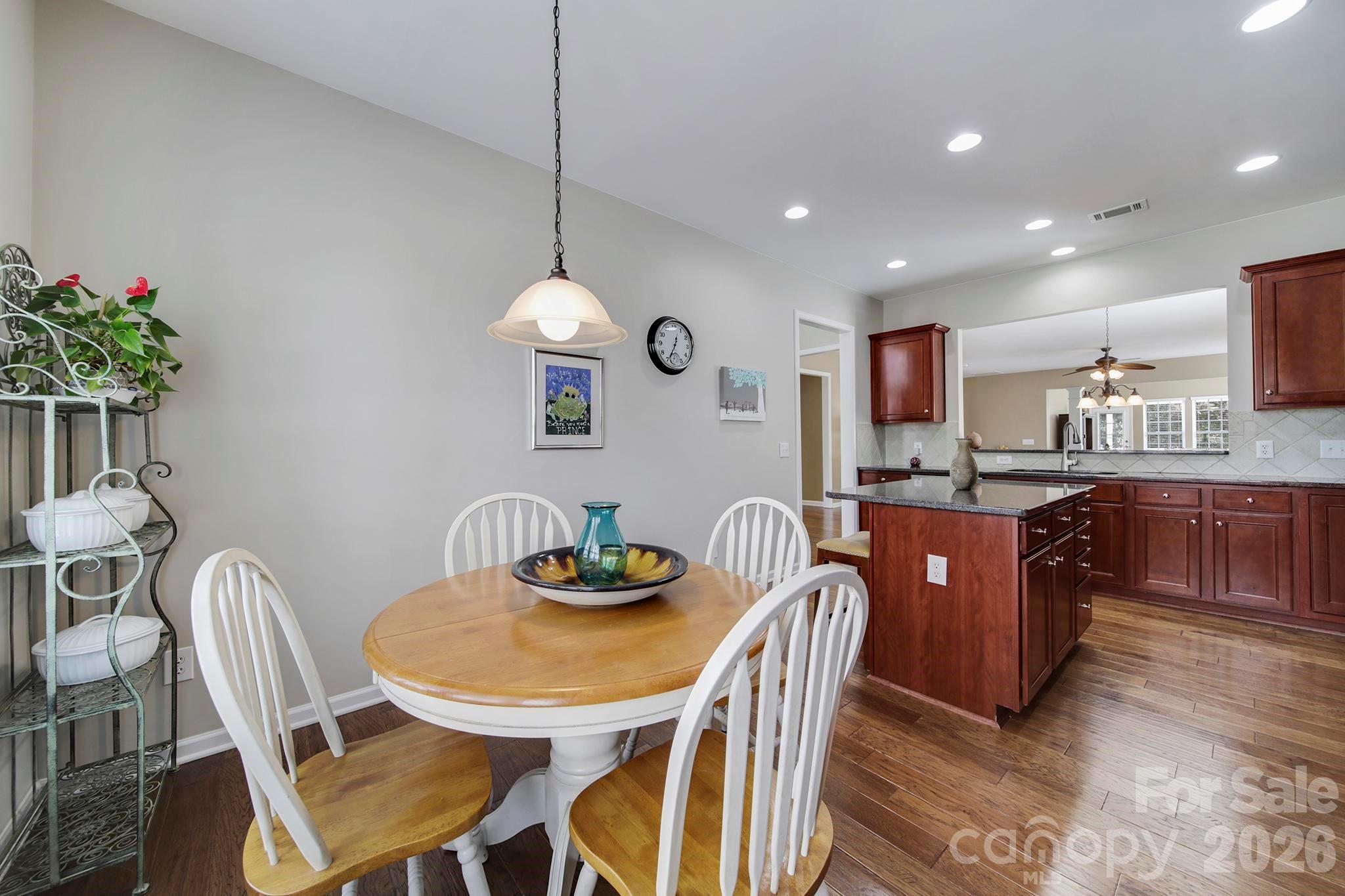 55414 Derringer Avenue Fort Mill, SC 29707 - Photo 8 of 45 a large kitchen with a table and chairs