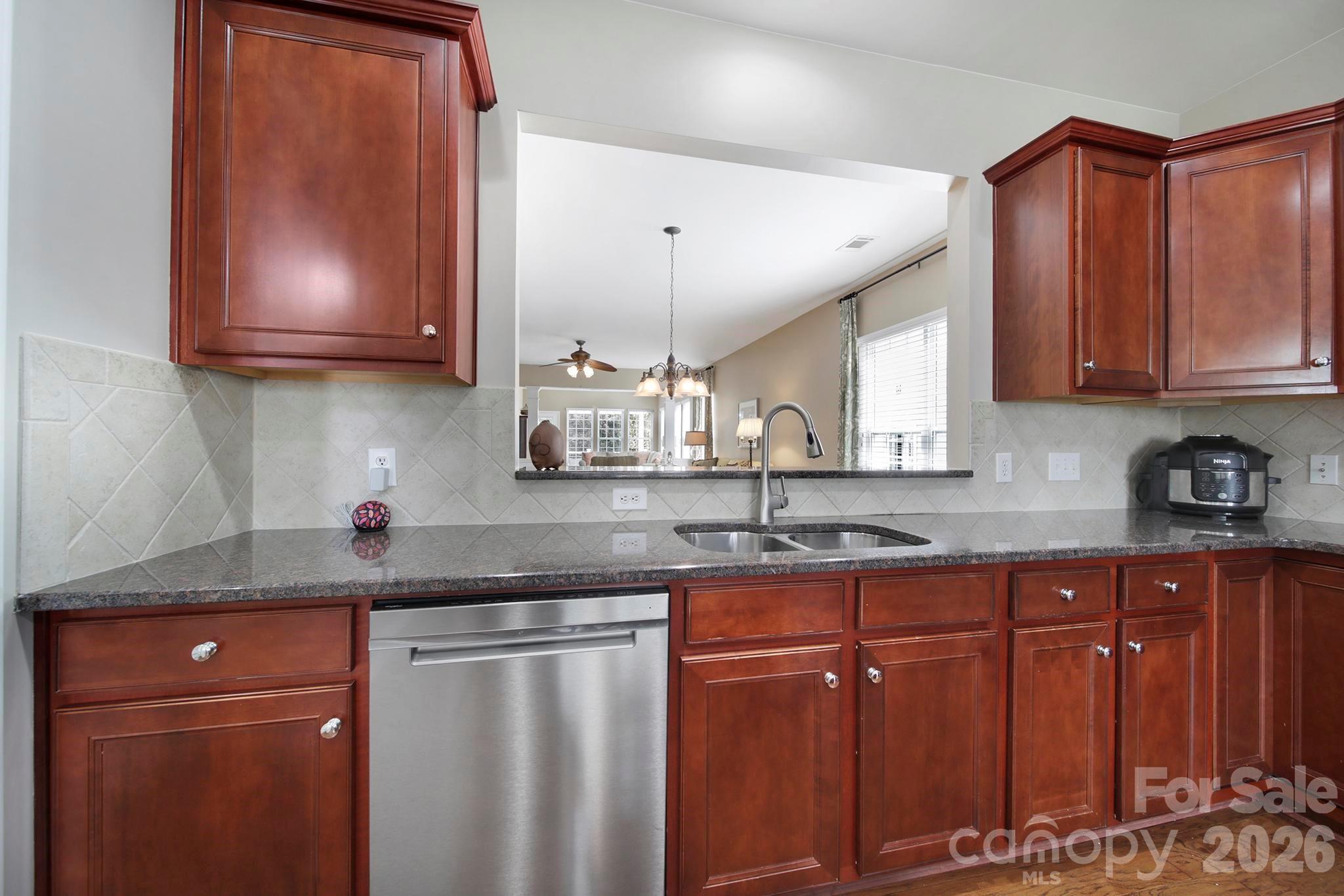 55414 Derringer Avenue Fort Mill, SC 29707 - Photo 9 of 45 a kitchen with stainless steel appliances granite countertop a sink stove and cabinets