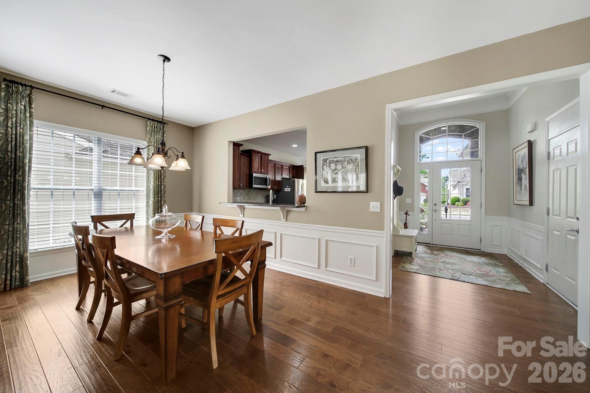 55414 Derringer Avenue Fort Mill, SC 29707 - Photo 10 of 45 a view of a dining room with furniture window and wooden floor
