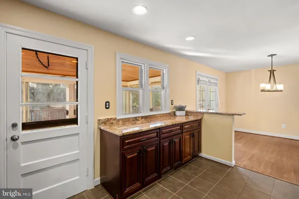a kitchen with stainless steel appliances granite countertop a stove and a sink