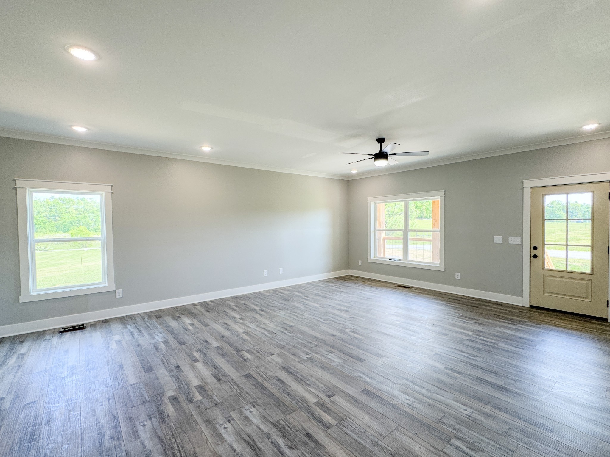 181 Rock House Hollow Road Bethpage, TN 37022 - Photo 15 of 51 an empty room with wooden floor and windows