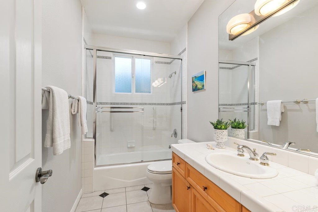 339 Hestia Way Encinitas, CA 92024 - Photo 33 of 33 a bathroom with a granite countertop sink toilet and shower