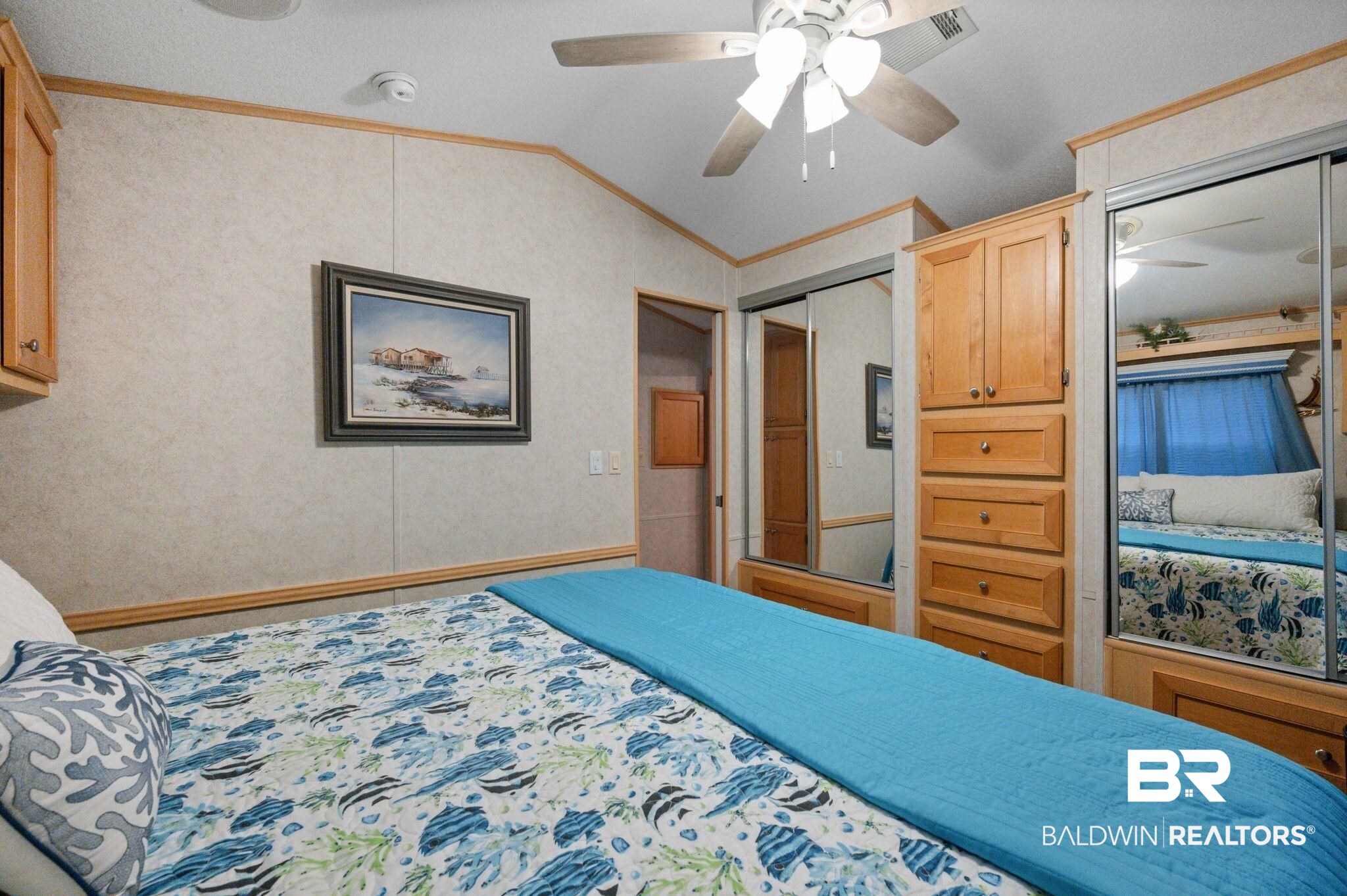 24711 County Road 20, Unit A11 Elberta, AL 36530 - Photo 14 of 35 Bedroom featuring crown molding, a ceiling fan, lofted ceiling, and a closet