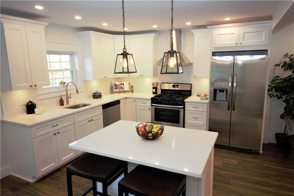 319 Ridge Road Sewickley, PA 15143 - Photo 2 of 25 Quartz counter tops, stainless steel appliances, Kraus sink faucet, and garbage disposal