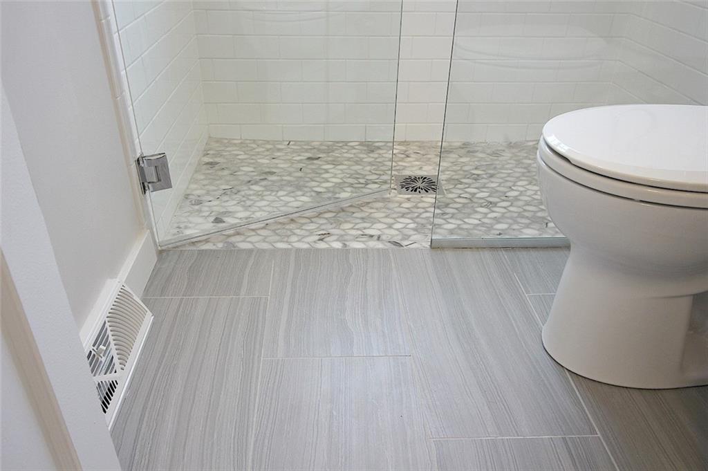 319 Ridge Road Sewickley, PA 15143 - Photo 14 of 25 curbless entry to shower, marble shower floor, porcelain tile main floor, American standard toiletAll maintenance free with the use of a high performance grout (no sealing ever needed)