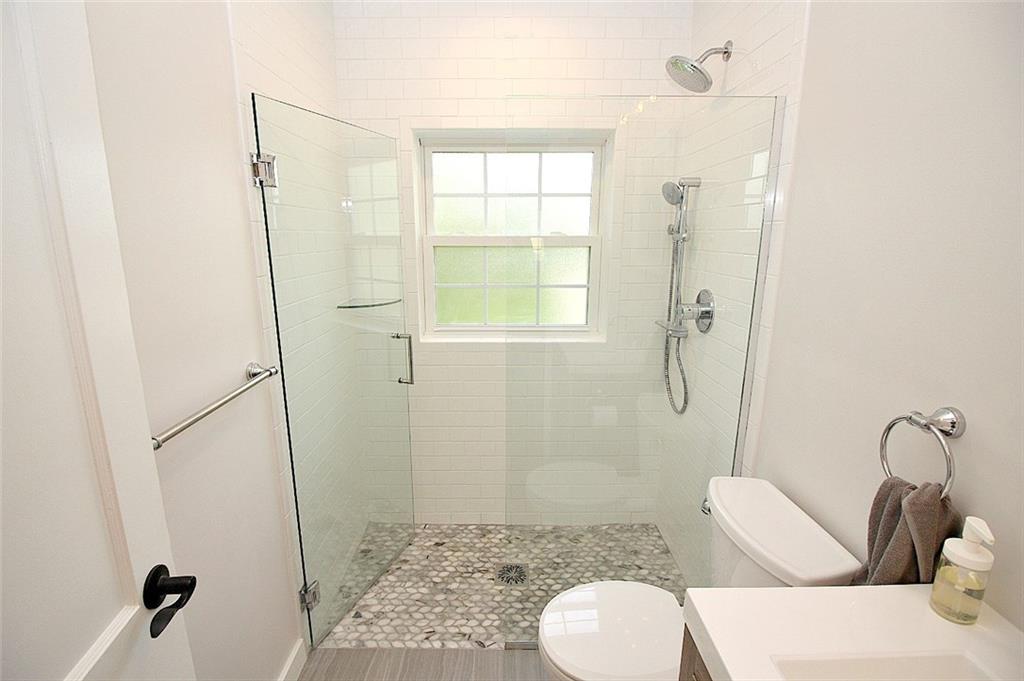 319 Ridge Road Sewickley, PA 15143 - Photo 3 of 25 Curbless walk-in shower with marble mosaic flooring and Grohe Shower system