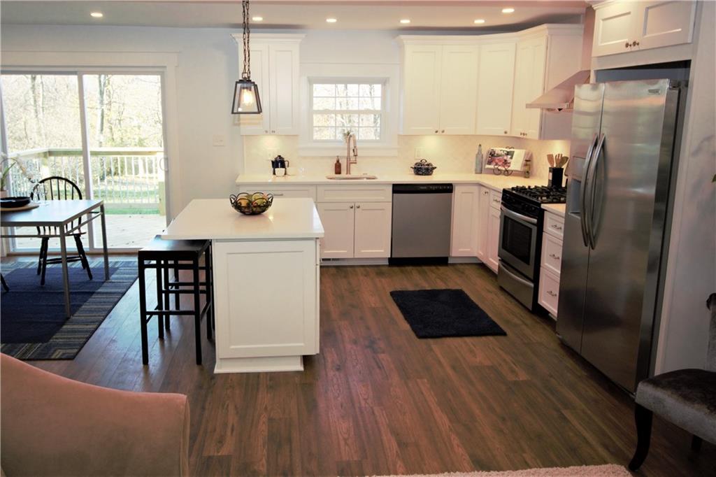 319 Ridge Road Sewickley, PA 15143 - Photo 5 of 25 Open kitchen layout, LED under cabinet lighting, elegant white backsplash