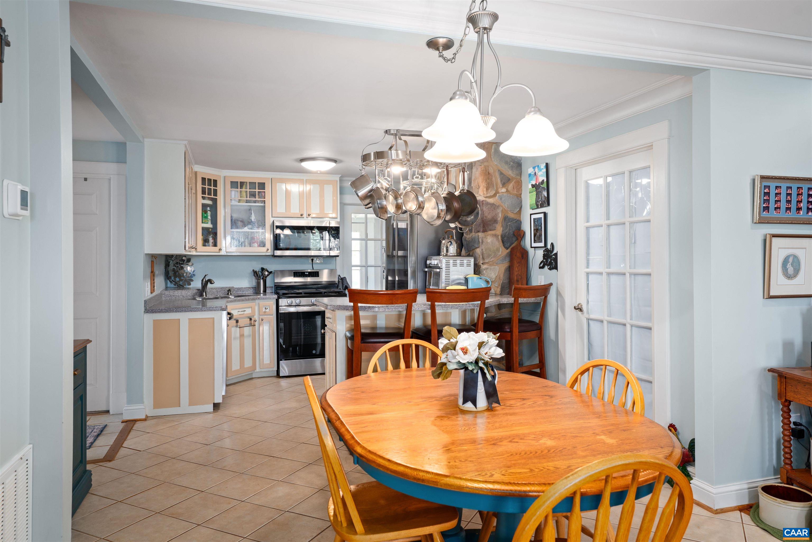 3486 Fredericksburg Road Ruckersville, VA 22968 - Photo 7 of 37 a dining room filled chandelier and kitchen view