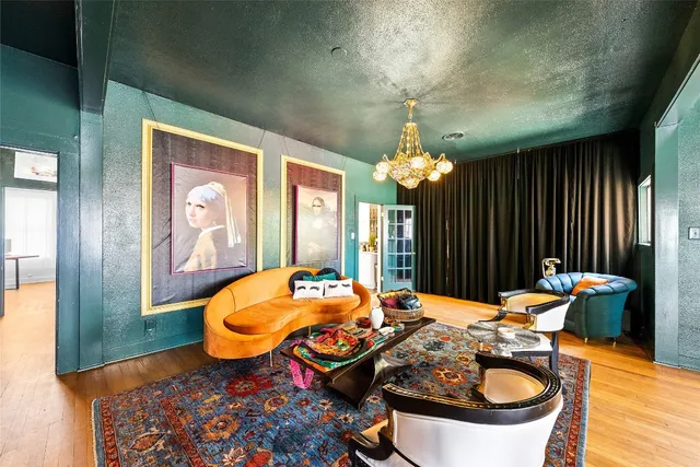 a dining room with furniture and chandelier