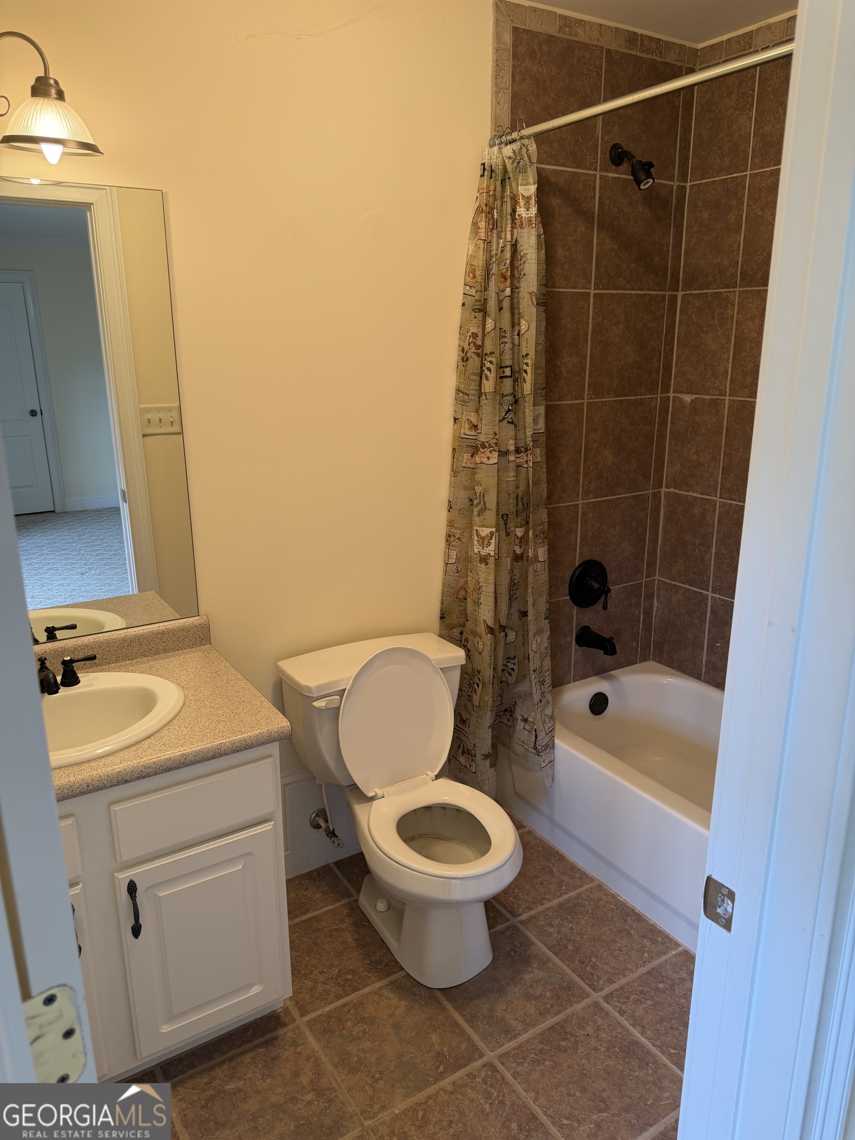 302 Norris Road Barnesville, GA 30204 - Photo 56 of 65 a bathroom with a toilet a sink and a bathtub