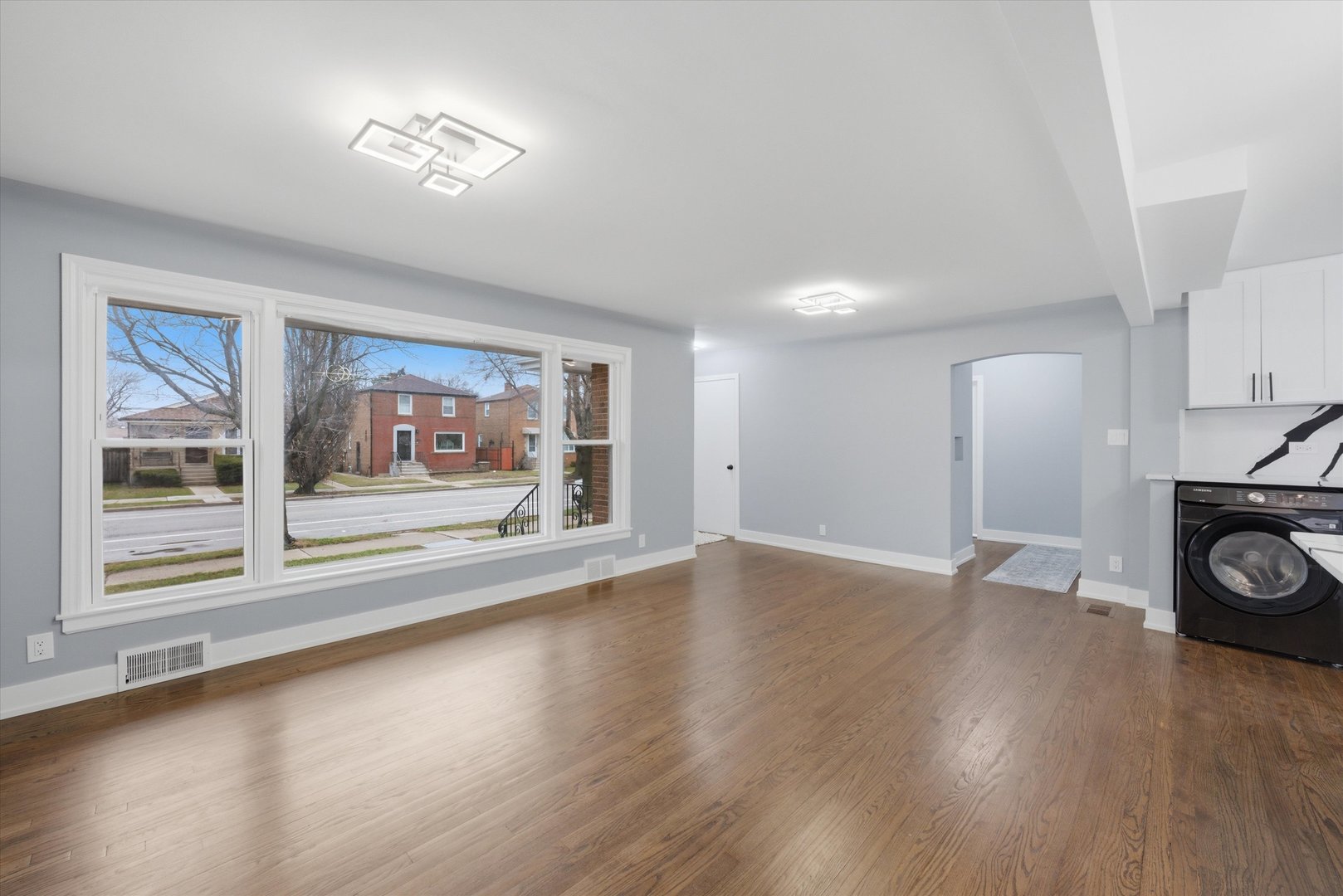 3743 West 83rd Street Chicago, IL 60652 - Photo 13 of 51 a view of a room with wooden floor and fireplace