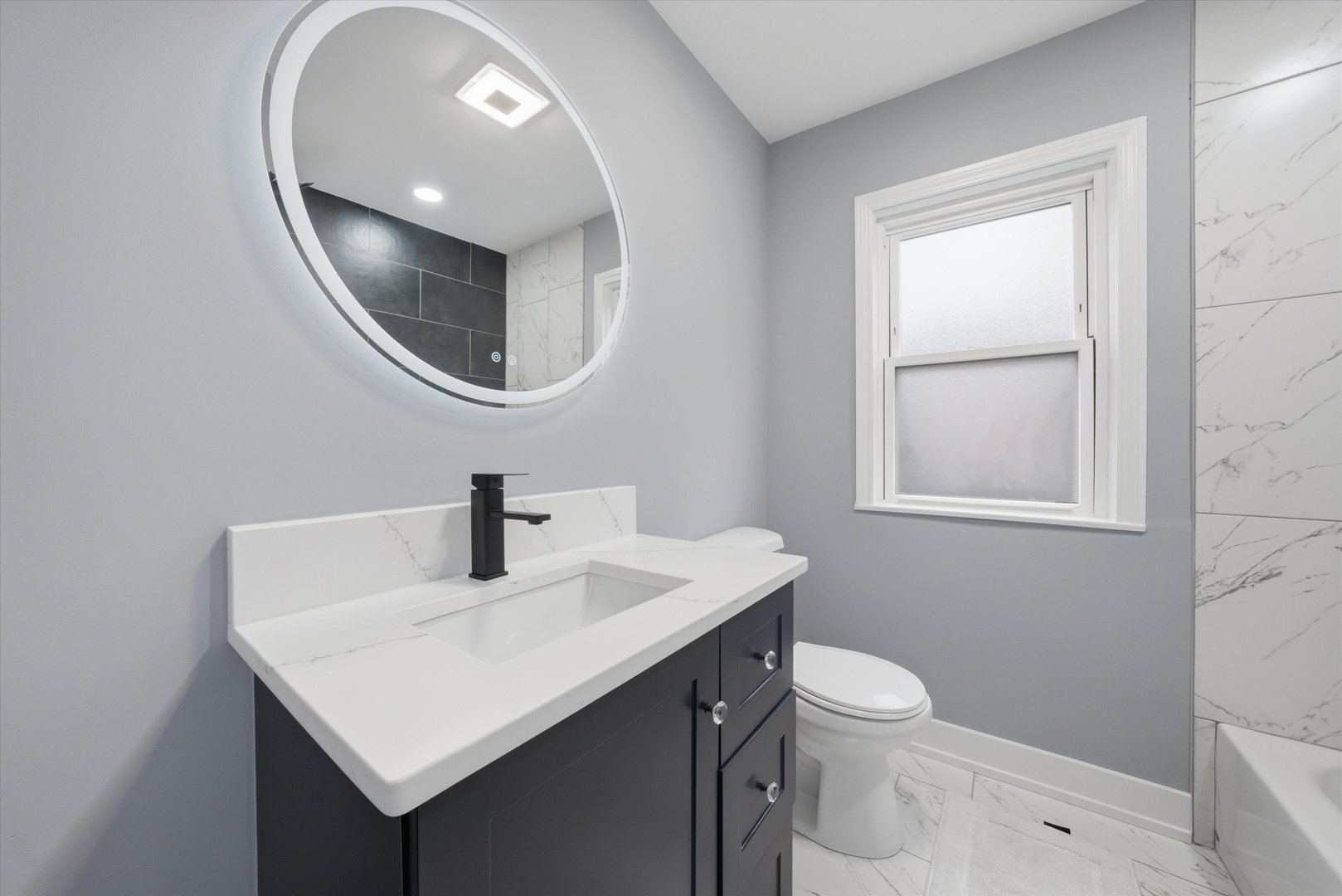 3743 West 83rd Street Chicago, IL 60652 - Photo 18 of 51 a bathroom with a toilet a sink and a mirror