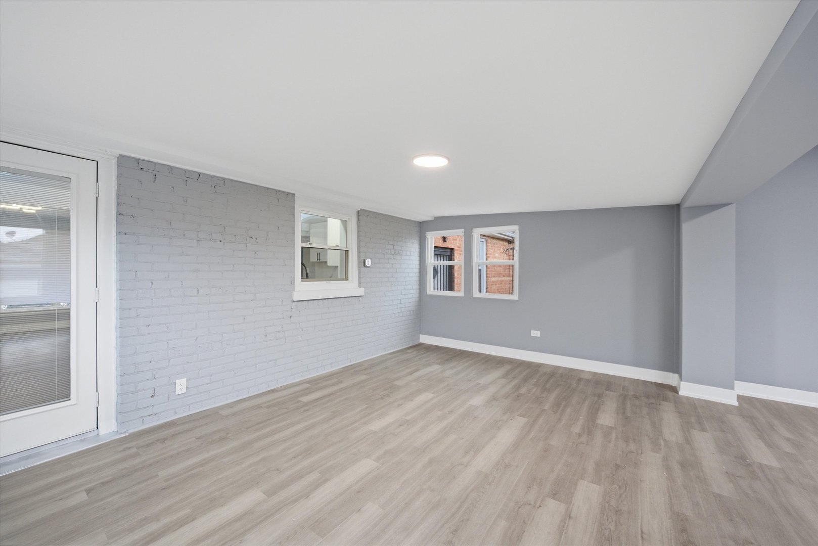 3743 West 83rd Street Chicago, IL 60652 - Photo 25 of 51 a view of an empty room with wooden floor and a window