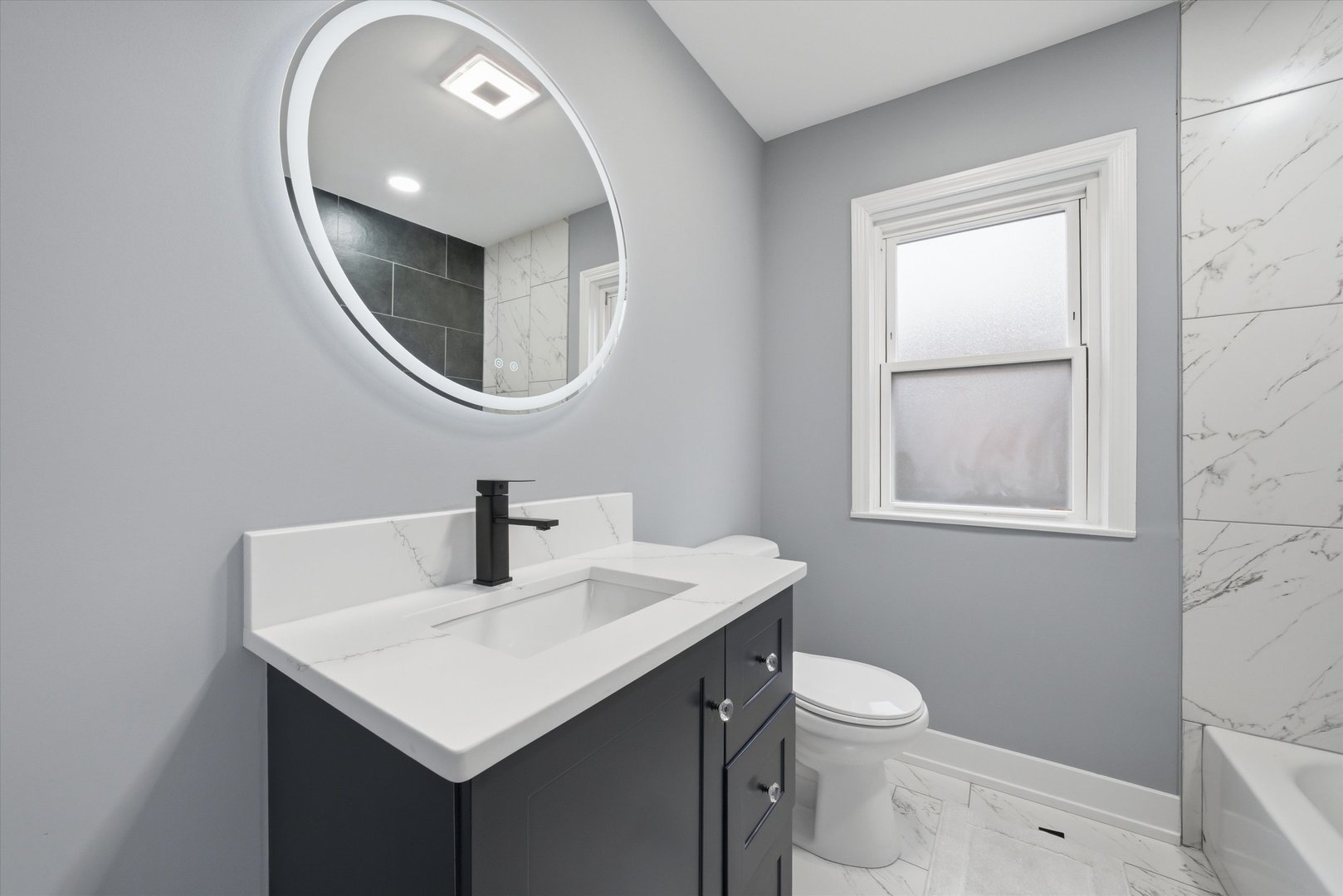 3743 West 83rd Street Chicago, IL 60652 - Photo 26 of 51 a bathroom with a toilet a sink and a mirror