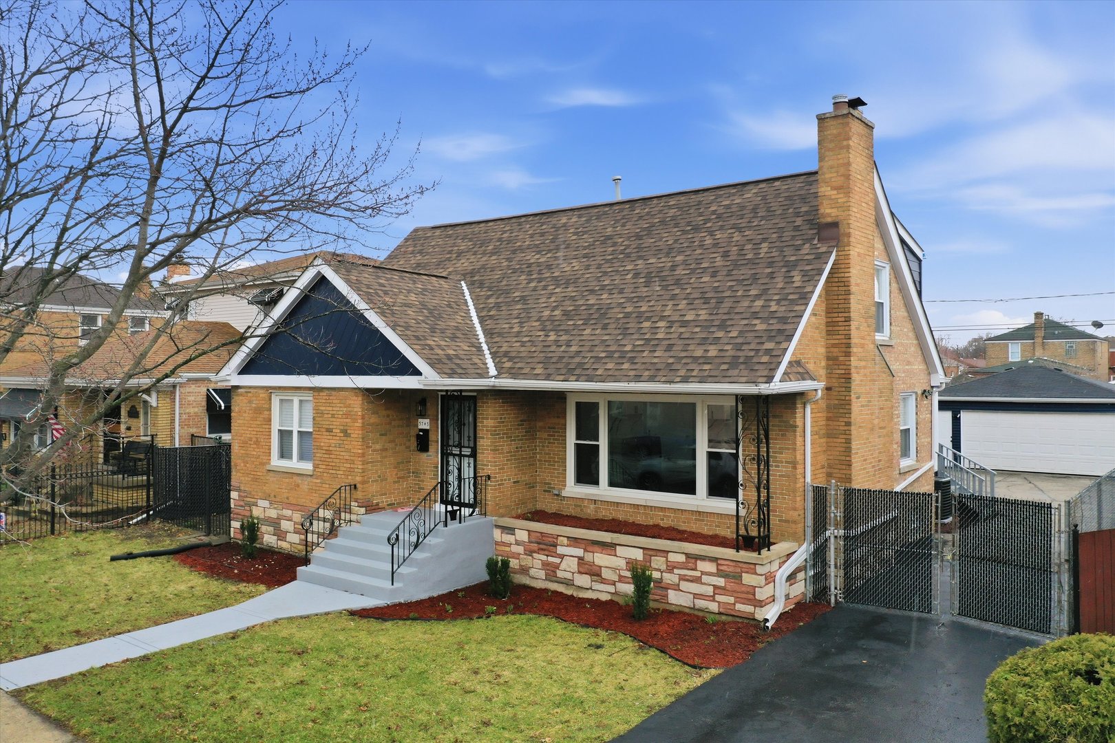 3743 West 83rd Street Chicago, IL 60652 - Photo 3 of 51 a front view of a house with a garden