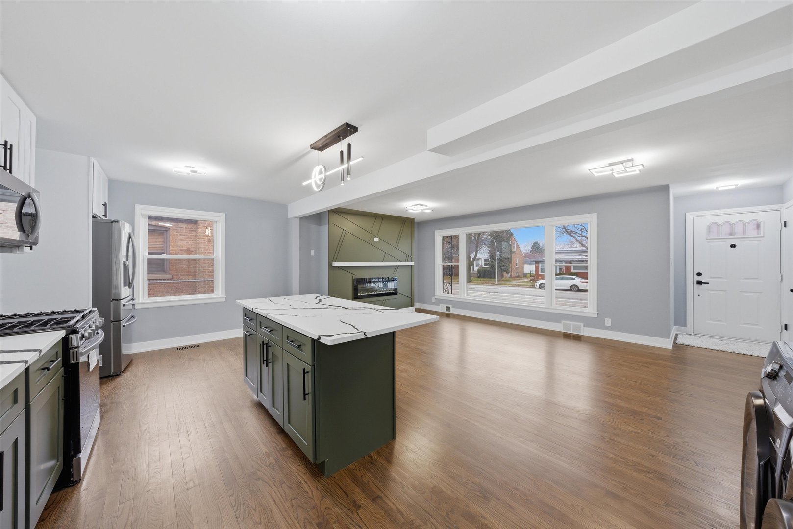 3743 West 83rd Street Chicago, IL 60652 - Photo 8 of 51 a kitchen with granite countertop a stove top oven and a wooden floor