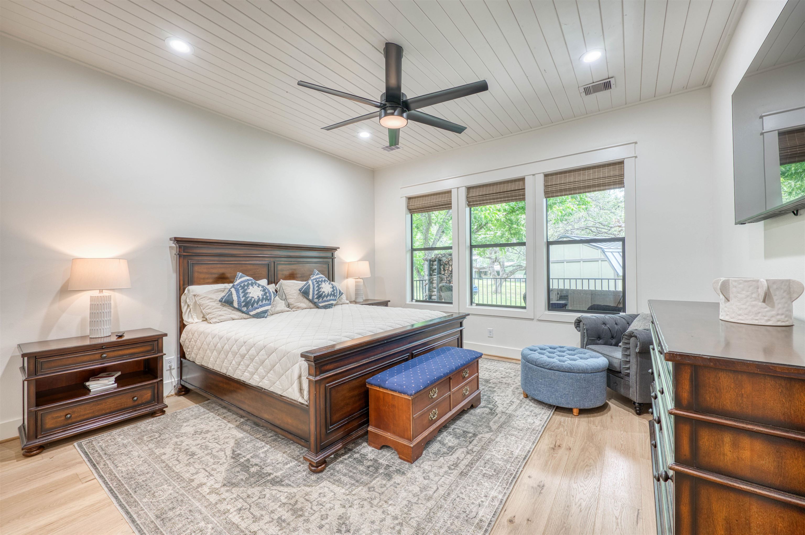 2001 Granite Cove Road Kingsland, TX 78639 - Photo 5 of 42 a bedroom with a bed and a chandelier