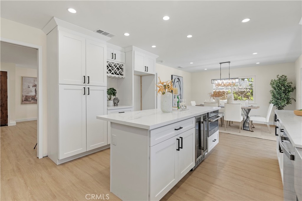 645 Lancer Lane Corona, CA 92879 - Photo 17 of 69 a kitchen with stainless steel appliances granite countertop a sink and a refrigerator