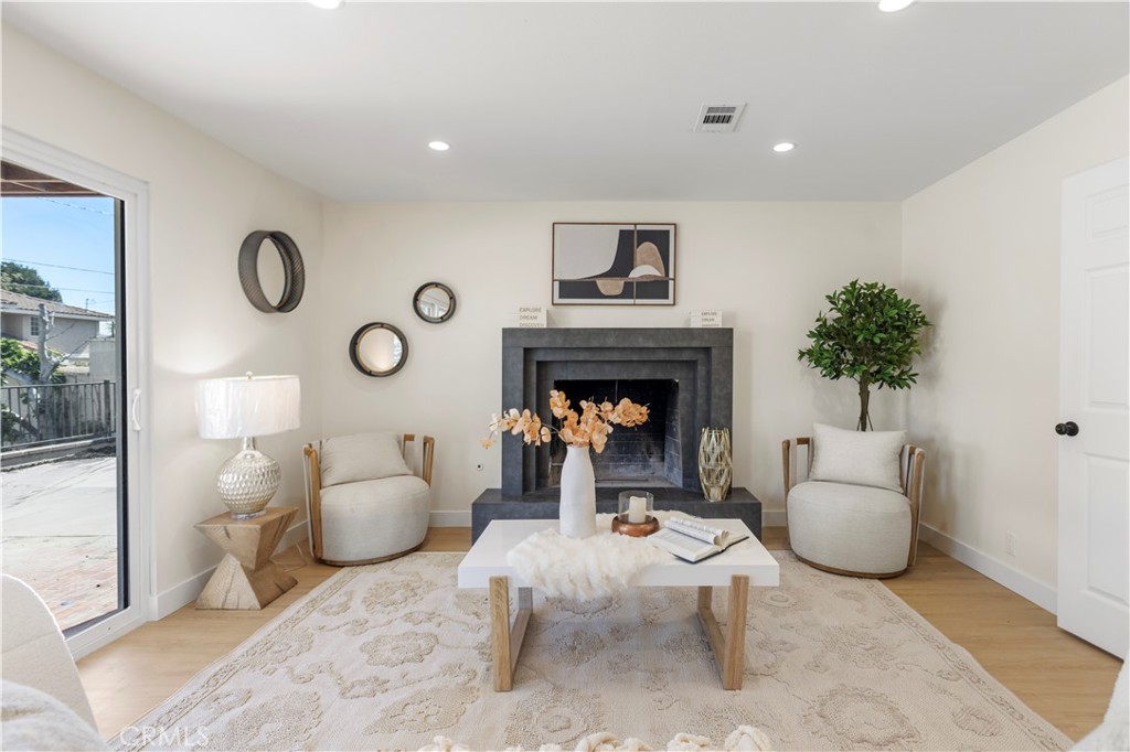 645 Lancer Lane Corona, CA 92879 - Photo 20 of 69 a living room with furniture and a fireplace