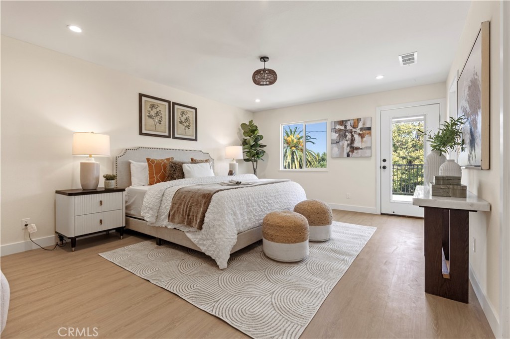 645 Lancer Lane Corona, CA 92879 - Photo 34 of 69 a bedroom with a large bed and a large window