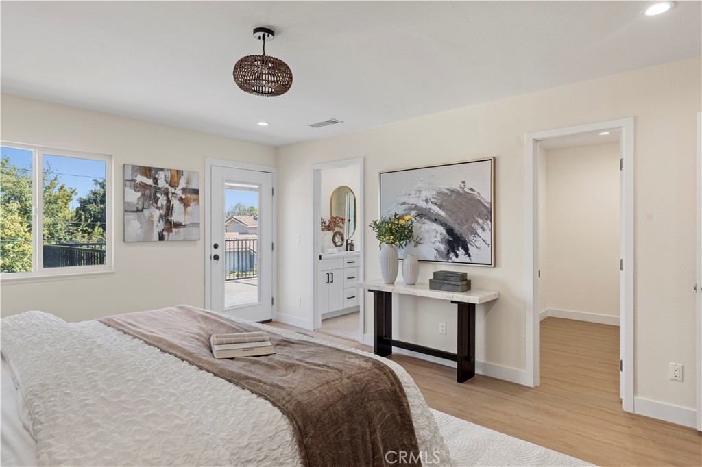 645 Lancer Lane Corona, CA 92879 - Photo 36 of 69 a bedroom with a bed and a table