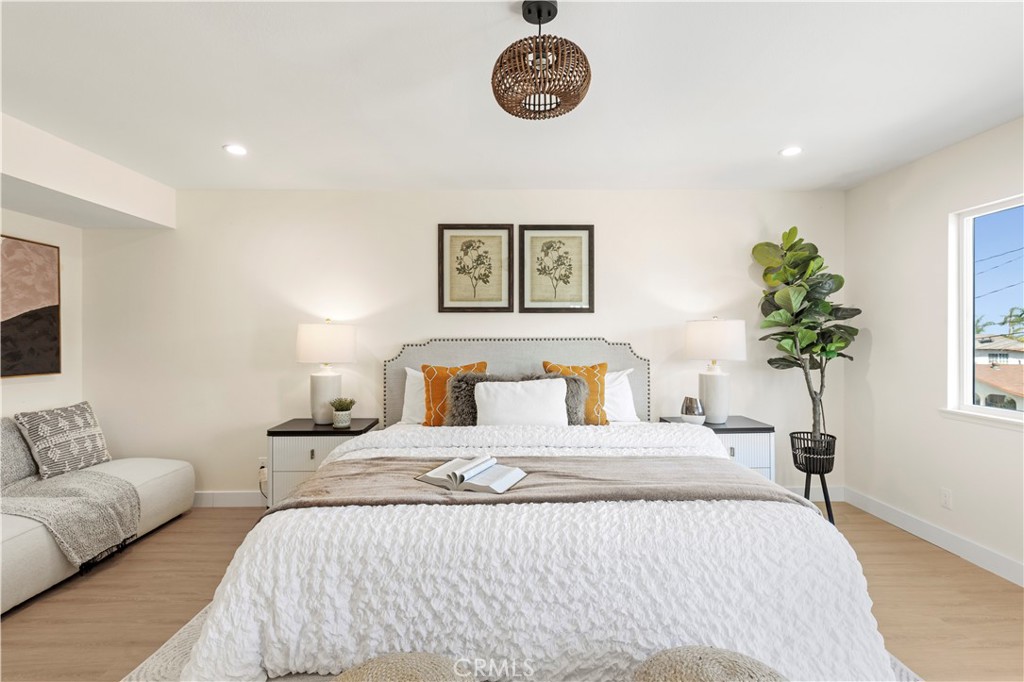 645 Lancer Lane Corona, CA 92879 - Photo 38 of 69 a bedroom with bed and a potted plant