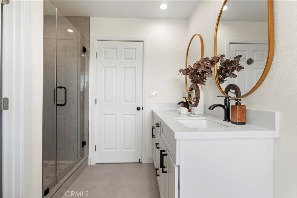 645 Lancer Lane Corona, CA 92879 - Photo 40 of 69 a bathroom with a sink and a mirror