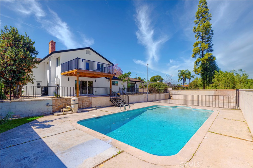 645 Lancer Lane Corona, CA 92879 - Photo 50 of 69 a view of a swimming pool with sitting area