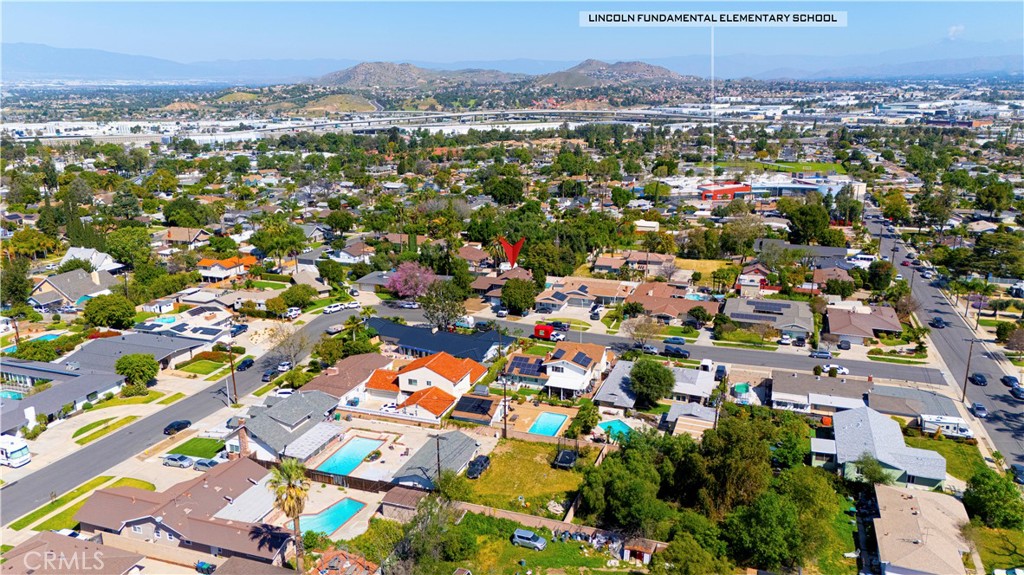645 Lancer Lane Corona, CA 92879 - Photo 58 of 69 an aerial view of residential houses with outdoor space and trees