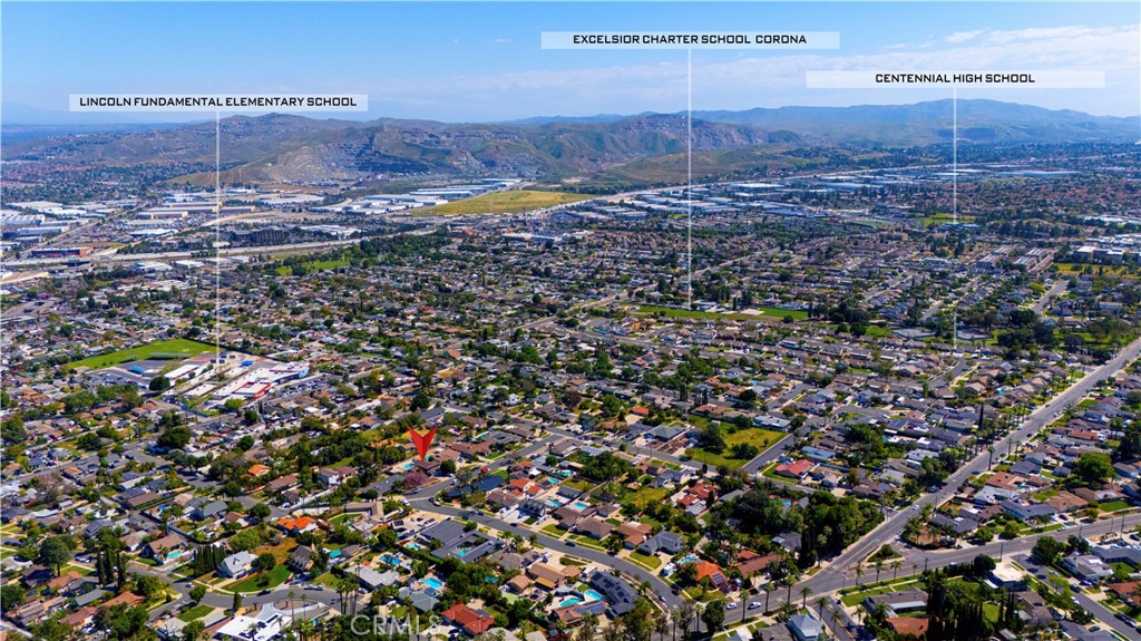 645 Lancer Lane Corona, CA 92879 - Photo 60 of 69 an aerial view of a house with a yard and mountain view in back
