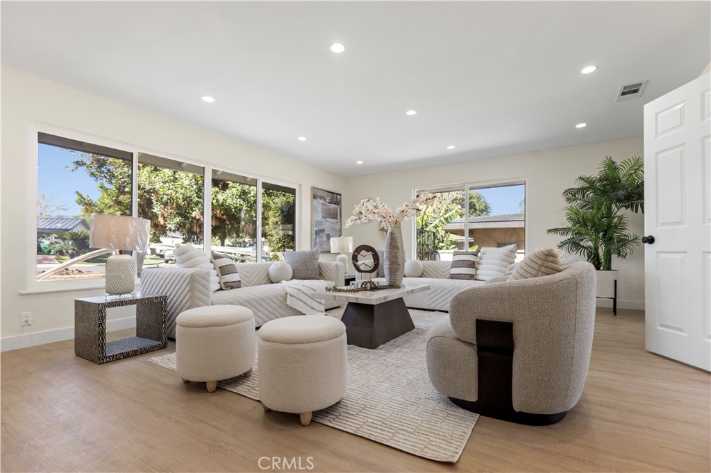 645 Lancer Lane Corona, CA 92879 - Photo 6 of 69 a living room with fireplace furniture and a large window