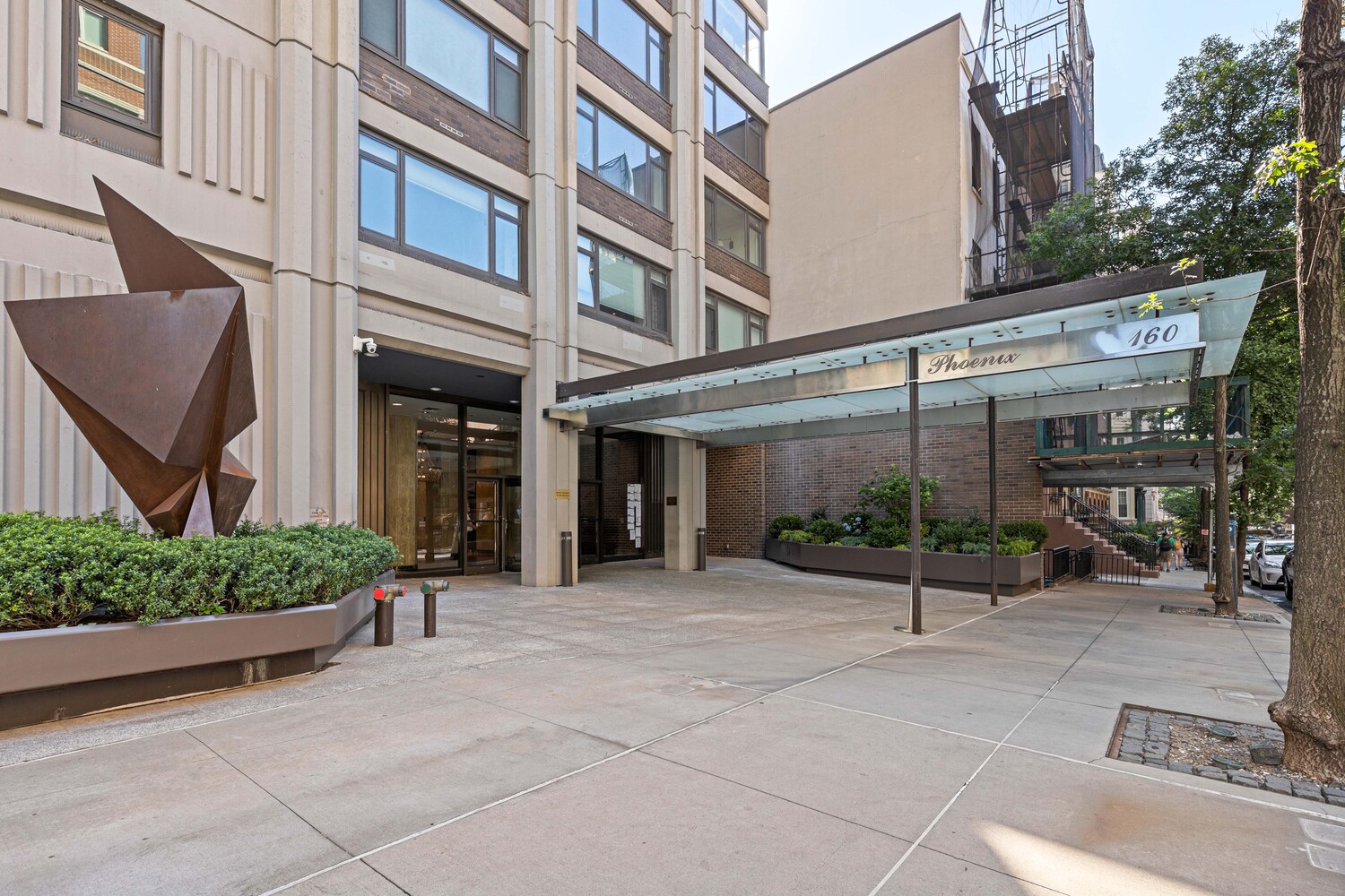 160 East 65th Street, Unit 26B Manhattan, NY 10065 - Photo 11 of 12 a view of a building with a garden