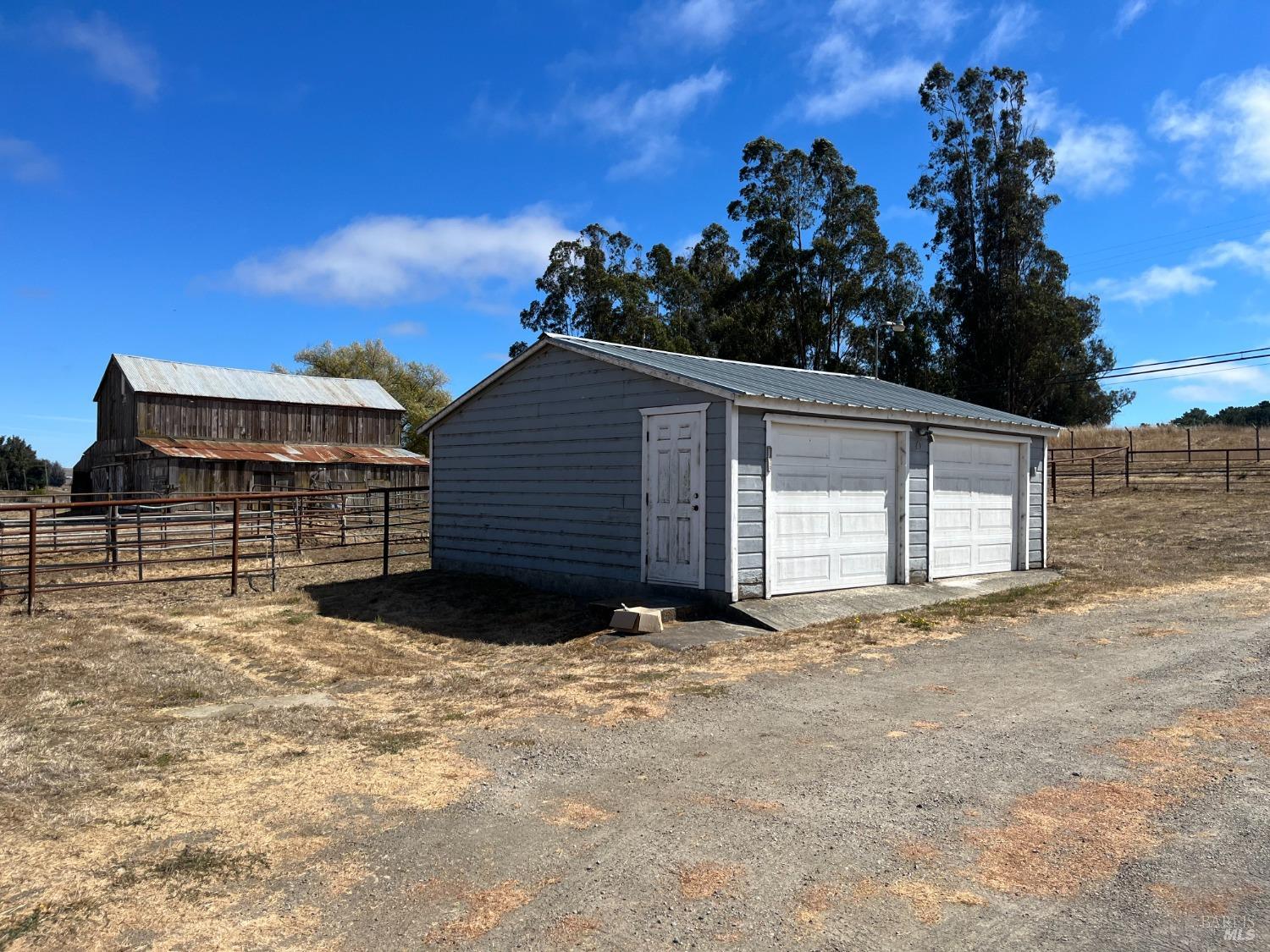 530 Tomales Road Petaluma, CA 94952 - Photo 23 of 32 a view of a house with a yard and garage