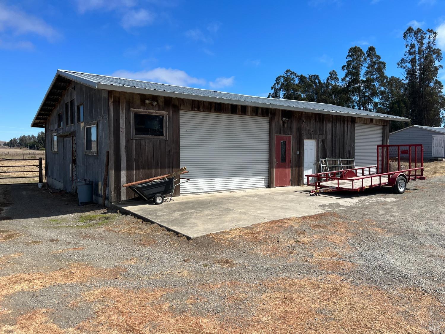 530 Tomales Road Petaluma, CA 94952 - Photo 28 of 32 a view of a house with a patio and a yard