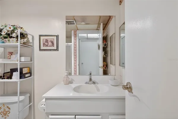 a bathroom with a sink and a mirror