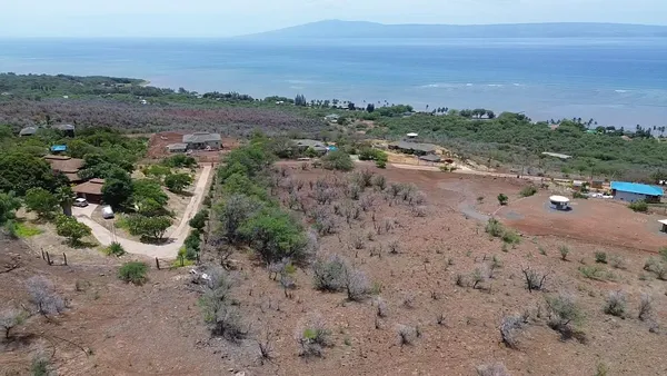 a view of a road with an ocean view