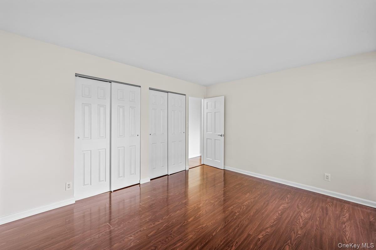 168-11 12th Avenue, Unit 3D Queens, NY 11357 - Photo 13 of 21 a view of an empty room with wooden floor