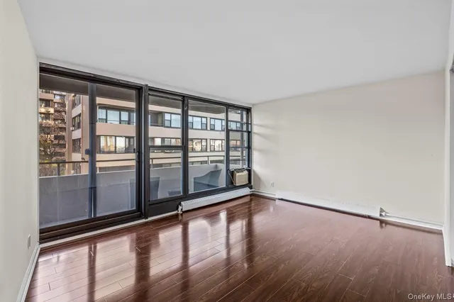 a view of kitchen with stainless steel appliances refrigerator microwave and stove