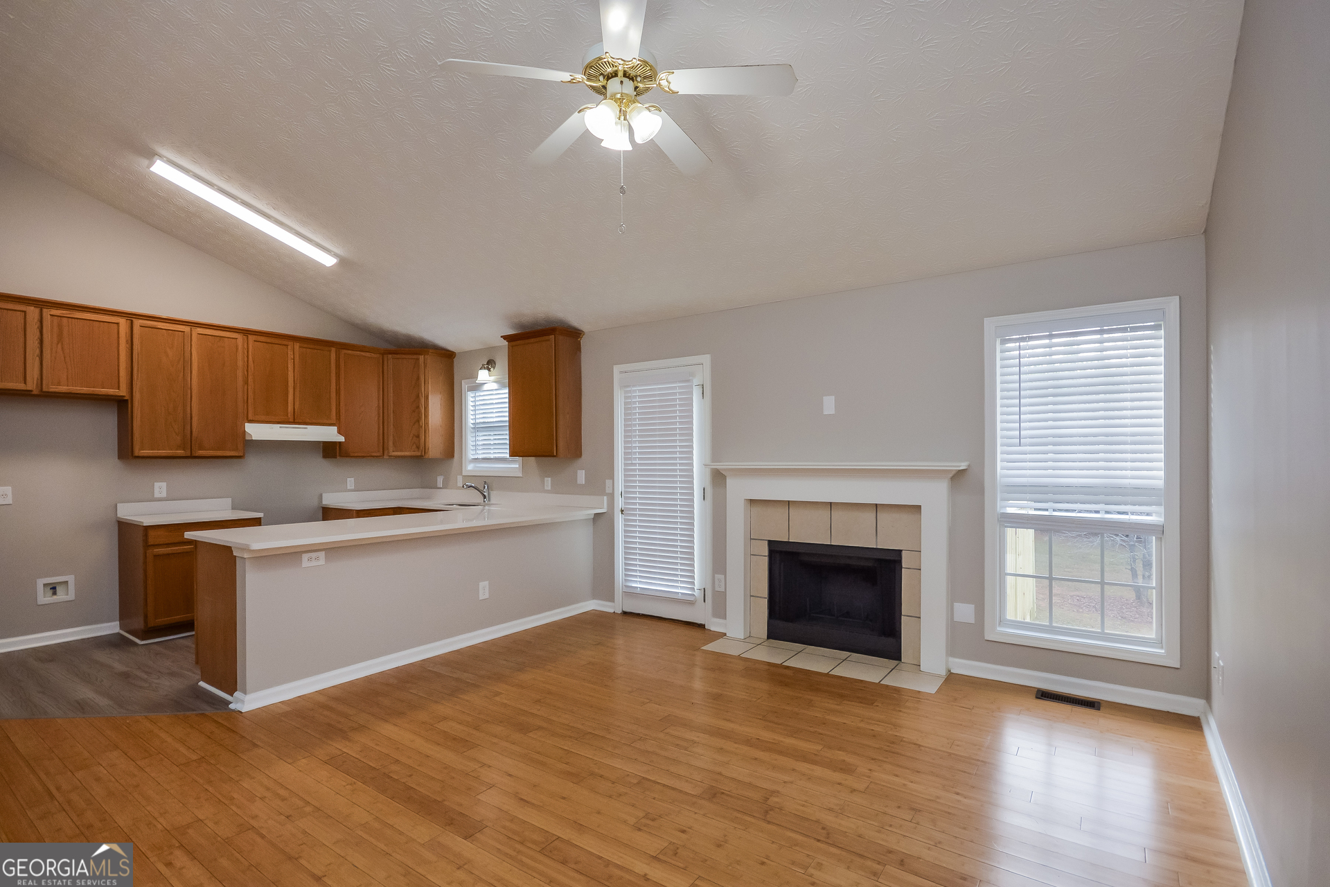 110 Tara Way Covington, GA 30016 - Photo 4 of 17 a large kitchen with a stove top oven and sink