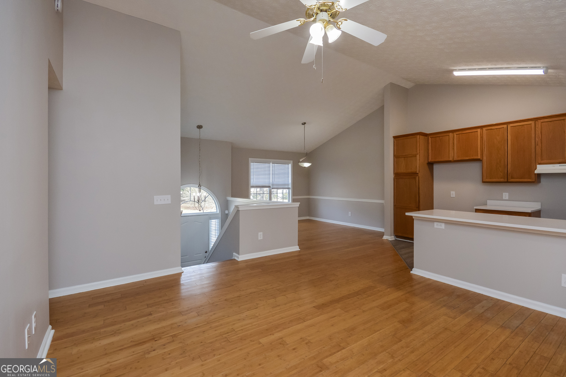 110 Tara Way Covington, GA 30016 - Photo 5 of 17 a view of a kitchen with a sink cabinets and wooden floor