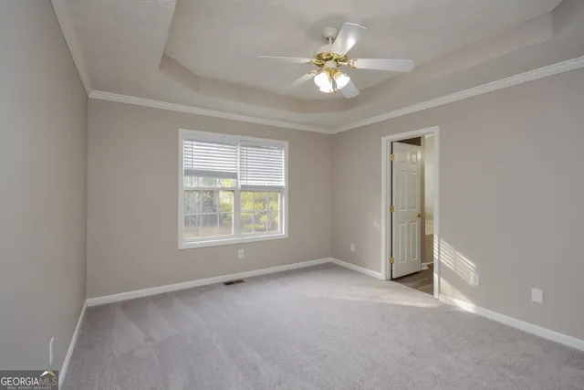 a view of an empty room with a bathroom