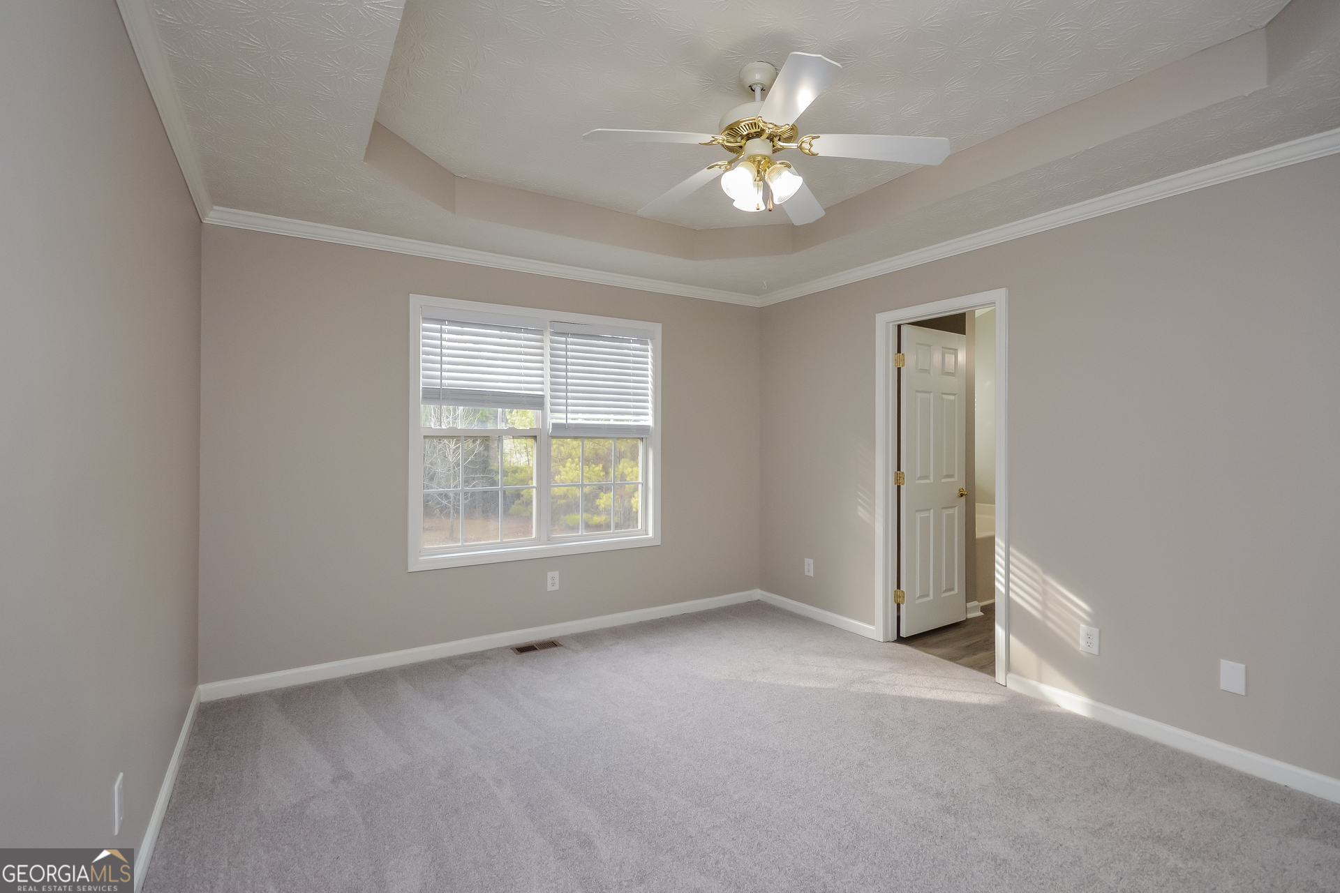 110 Tara Way Covington, GA 30016 - Photo 9 of 17 wooden floor in an empty room with a window