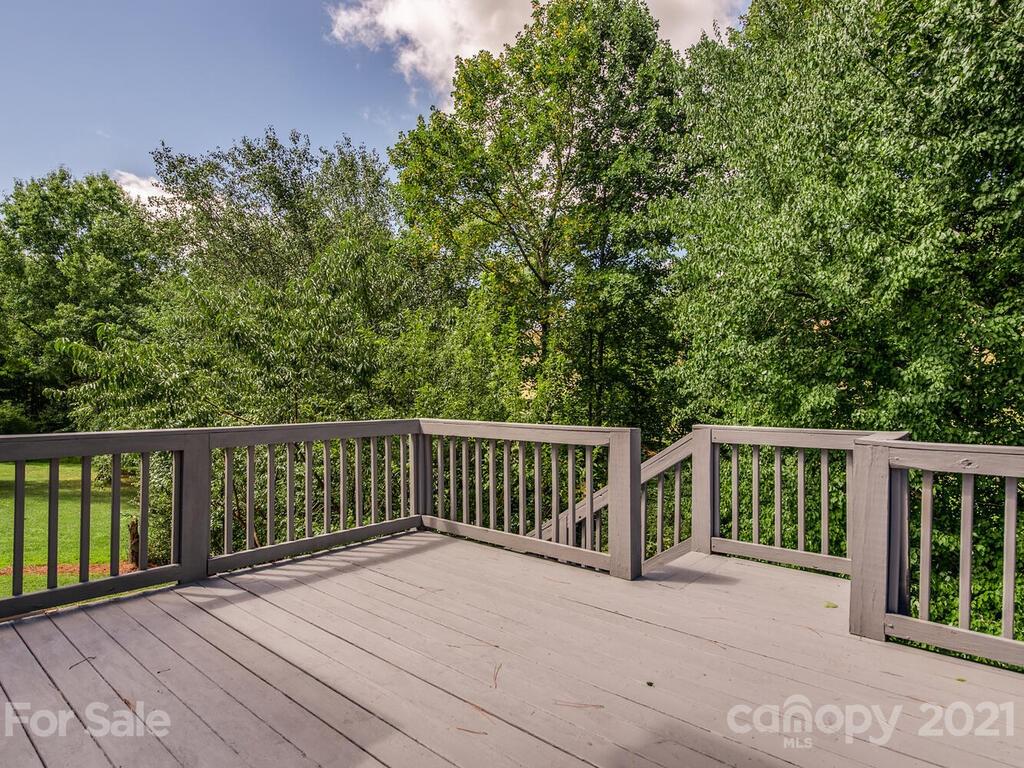 5530 Piper Glen Drive Charlotte, NC 28277 - Photo 13 of 35 a view of balcony with wooden floor and fence