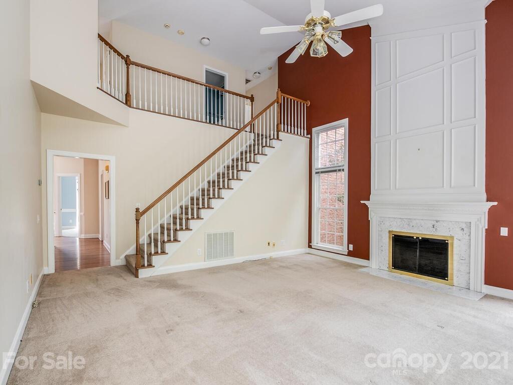5530 Piper Glen Drive Charlotte, NC 28277 - Photo 16 of 35 a view of entryway and hall with a fireplace