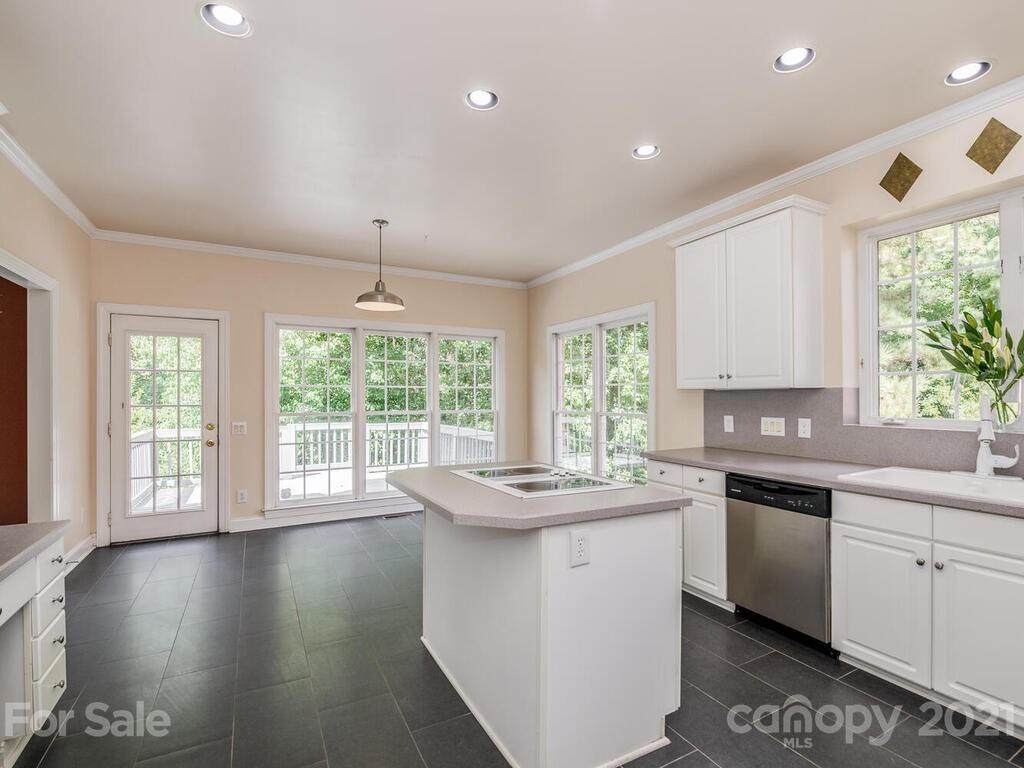5530 Piper Glen Drive Charlotte, NC 28277 - Photo 9 of 35 a kitchen with stainless steel appliances granite countertop a sink a stove and a window