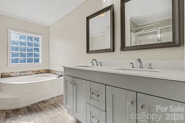 a kitchen with stainless steel appliances kitchen island granite countertop a refrigerator oven a sink and dishwasher