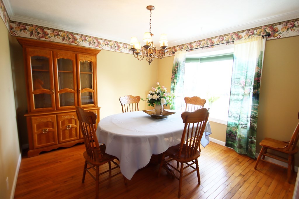 154 Charleston Road Cookeville, TN 38506 - Photo 11 of 23 a view of a dining room with furniture window and wooden floor